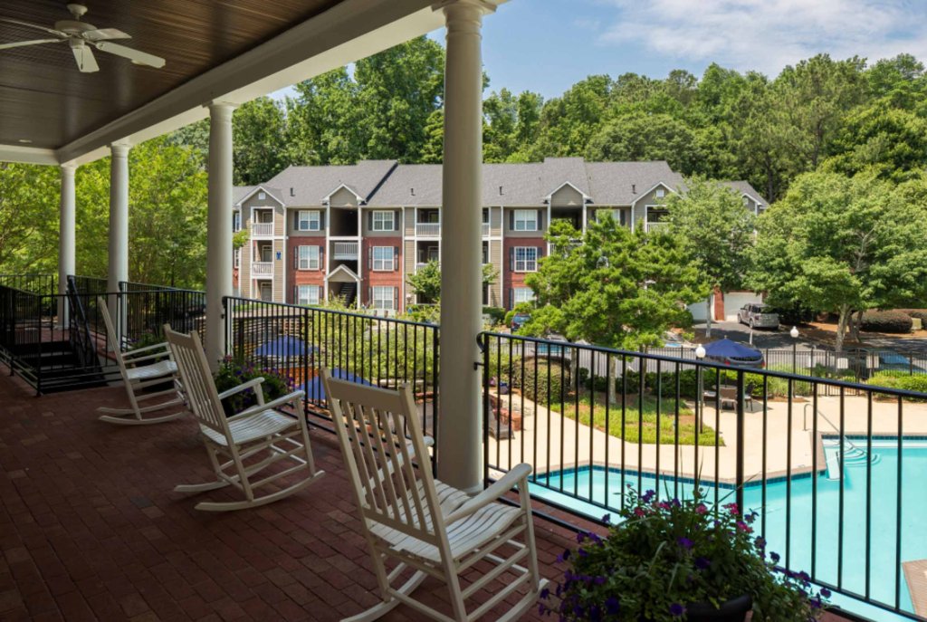 community area at sandy springs apartments the retreat at river park overlooking the pool